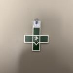 Croix Infirmière verte avec ventouse